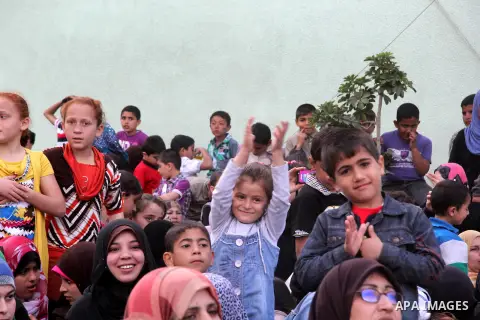 Palestinians participate in a ceremony at the Al- Amal Institute for orphans in Gaza City, on Apr. 12, 2013. Photo by Ezz al-Zanoon