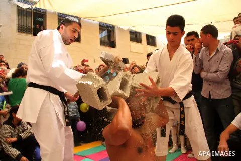 Palestinian students participate in an open day under the slogan "Hekaya" in Birtzeit University in the West Bank city of Ramallah, on April 13, 2013. Photo by Issam Rimawi
