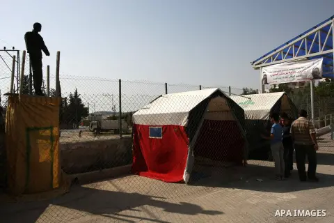 Palestinians take part in Palestinian prisoners exhibition in the West Bank village of Tarqumiya northern city of Hebron, on April 14, 2013. The exhibition organized in solidarity with Palestinian prisoners in Israeli ja...