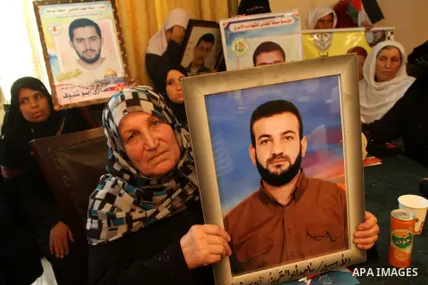 Palestinians take part in a ceremony organised by Prisoners radio station on the fourth anniversary of its founding, and Ahead of Palestinian Prisoners' Day on April 17, in Gaza city on April 15, 2013. Photo by Mohammed...