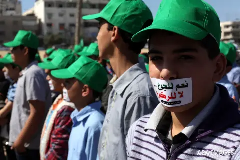 Palestinian muzzled children take part in a rally to show solidarity with Palestinian prisoners inside Israeli jails, in Gaza City April 15, 2013. According to a Palestinian prisoners' association, at least 4900 Palestin...
