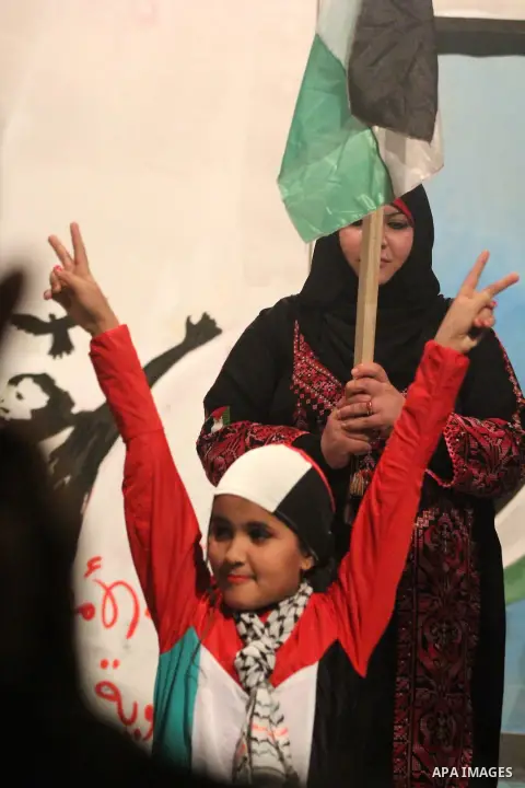 Palestinian artists perform during a ceremony organized by Islamic Jihad movement, to show solidarity with Palestinian prisoners inside Israeli jails, ahead of Palestinian prisoner's day in Gaza city on April 16, 2013. P...