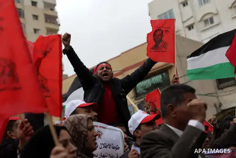 Palestinians chant slogans as they take part in a rally marking Palestinian Prisoners Day in Gaza City April 17, 2013. According to a Palestinian prisoners' association, at least 4,900 Palestinians remain in Israeli jail...