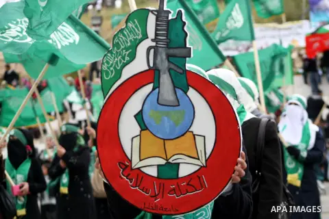 Hebron University students carry Hamas movement's flags during a rally to support the movement bloc in the election for the student council, in the West Bank city of Hebron on April 17, 2013. Hamas bloc had boycotted the...