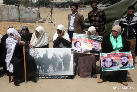 Palestinian female prisoners participate in a press conference for talk about the suffering of the Palestinian prisoners in Israeli jails, in Gaza City, Apr. 18, 2013. According to a Palestinian prisoners' association, a...