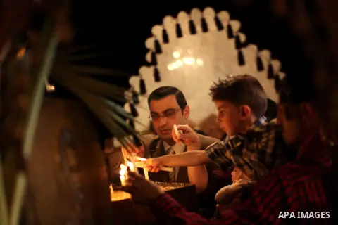 Christians attend Palm Sunday mass at the Saint Porfirios church in Gaza City on April 28, 2013. Photo by Ashraf Amra