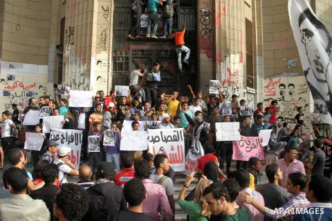 Students hold placards during a protest in front ofthe High court demanding the release of students arrested in previous violent demonstrations and to increase the political independence of the universities, on April 28,...