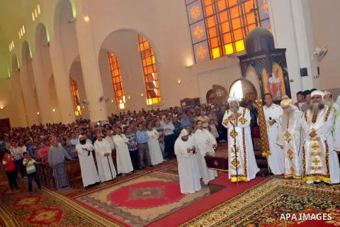 Egyptian Orthodox Christians take part in a mass marking the Palm Sunday on April 28, 2013 in Cairo. Palm Sunday marks the triumphant return of Jesus Christ to Jerusalem when a cheering crowd greeted him waving palm leav...