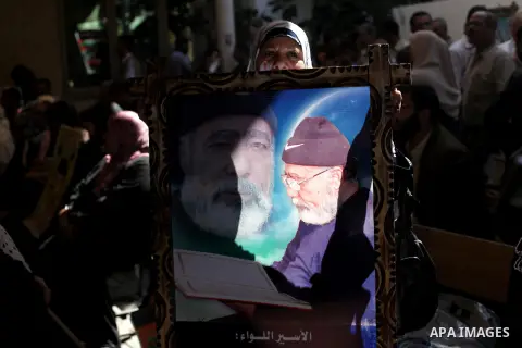 Palestinian women hold pictures of prisoners held in Israeli jails during a protest in front of the Red Cross offices in Gaza city, on Apr. 29, 2013 in solidarity with Palestinian prisoners held by Israel to demand their...