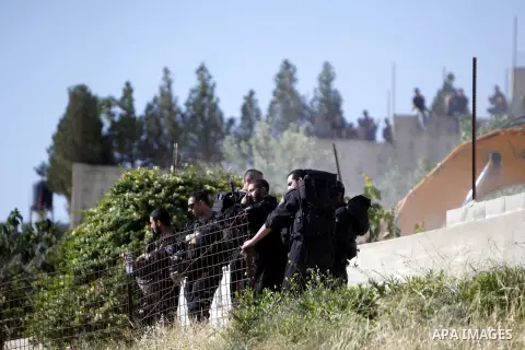 Israeli security forces stand guard as Jerusalem municipality workers use bulldozers to demolish a Palestinian home owned by Ghaith family in the mostly Arab east Jerusalem neighbourhood of al-Tur on April 29, 2013. Pale...