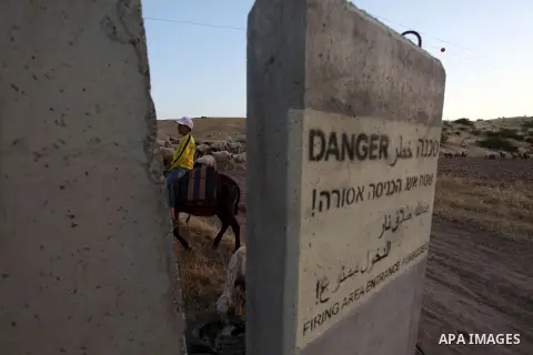 Bedouins load belongings into the back of a pick-up truck as he and his family leave their home in the West Bank village of Wadi al-Maleh, near the border with Jordan April 29, 2013. Israeli soldiers on Monday evicted se...