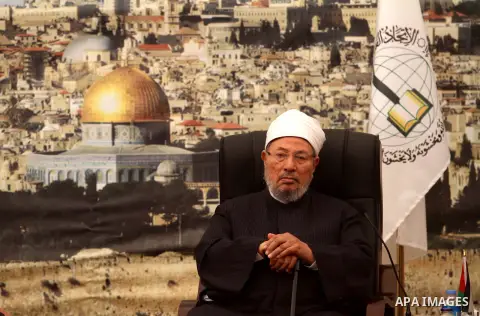 Palestinian Prime Minister Ismail Haniyeh meets with Egyptian Cleric and chairman of the International Union of Muslim Scholars Sheikh Yusuf al-Qaradawi after the latter's arrival in Gaza City on May 9, 2013. Al-Qaradawi...