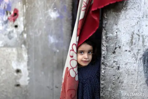 A Palestinian girl plays at her home in al-Shati refugees camp, in Gaza city on May 12, 2013, as Palestinians mark the 65 anniversary of the Nakba or "the catastrophe" which takes place on May 15, commemorating the expul...