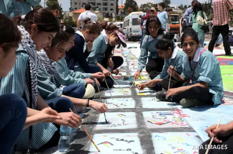 Palestinian students draw paintings to commemorate Nakba Day in the West Bank city of Ramallah in May 14, 2013. Palestinians are preparing to mark Nakba Day on May 15 which commemorates the exodus of hundreds of thousand...