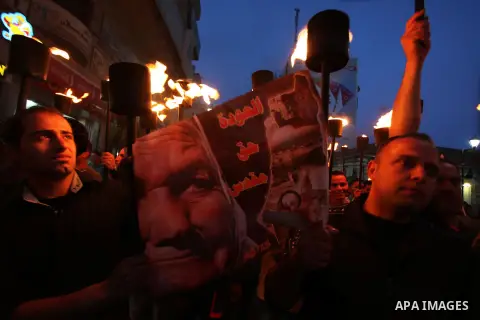 Palestinian protestors hold up torches during a rally to mark the beginning of the Nakba or the ''Day of Catastrophe'', in the old city of Ramallah on May 14, 2013. Palestinians will mark the 65th Nakba as a day of mourn...