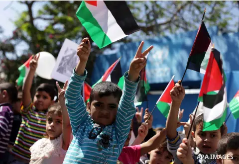 Palestinian children take part in a rally ahead of Nakba Day in front of the headquarters of the United Nations (Unrwa) in Gaza city May 15, 2013. Palestinians will mark "Nakba" (Catastrophe) on May 15 to commemorate the...