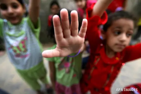 Palestinian refugees children play at the street in the Rafah refugee camp southern Gaza Strip on May 15, 2013. Nakba Day is the annual day of commemoration of the displacement of Palestinians after the establishment of...