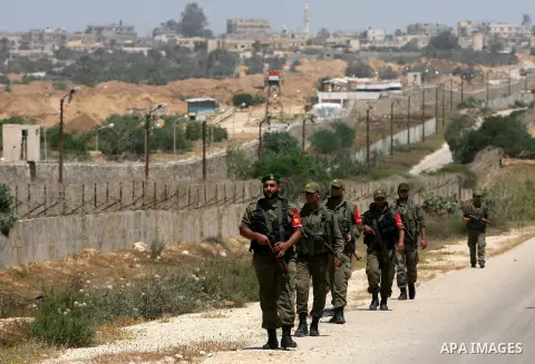 Palestinian security forces patrol the border area between Gaza and Egypt, in the southern Gaza Strip May 20, 2013. Egyptian police angered by the kidnapping of seven colleagues by Islamist gunmen kept a crossing into th...