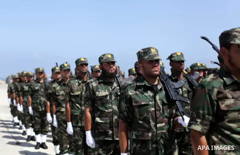 Palestinian members of national security forces march during a graduation ceremony in Gaza City May 21, 2013. Photo by Ashraf Amra