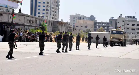 Palestinian members of national security forces show their skills during a graduation ceremony in Gaza City May 21, 2013. Photo by Mohammed Talatini