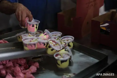 Palestinian employees work at al- Awda ice cream factory in Gaza city, on May, 23, 2013. Photo by Ashraf Amra