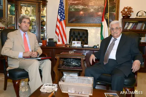 Palestinian President Mahmoud Abbas (R) meets with with US Secretary of State John Kerry (L) in Amman on May 27, 2013. Kerry unveiled a plan to boost the Palestinian economy by attracting $4 billion in private investment...