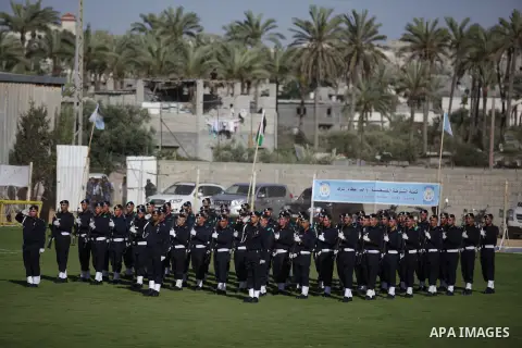 Palestinian security officers stand during a graduation ceremony in Deir al-Balah in the center of Gaza Strip May 28, 2013. Photo by Ashraf Amra