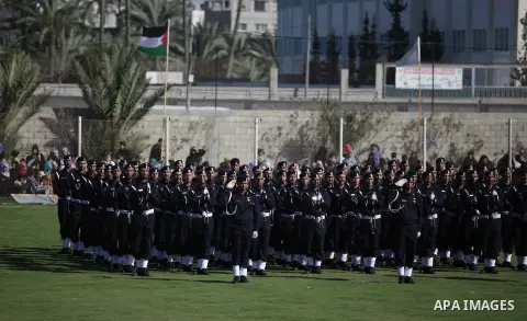 Palestinian security officers stand during a graduation ceremony in Deir al-Balah in the center of Gaza Strip May 28, 2013. Photo by Ashraf Amra