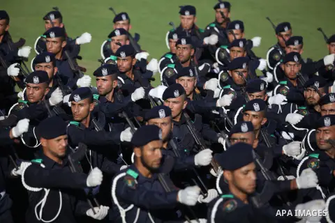 Palestinian security officers march during a graduation ceremony in Deir al-Balah in the center of Gaza Strip May 28, 2013. Photo by Ashraf Amra