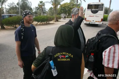 Members of the aid convoy of "Miles of Smiles 12" arrive at Rafah crossing border in souther Gaza Strip, June 05, 2013. Organisers of the campaign explained in a statement that the convoy comes 'in response to hardships...
