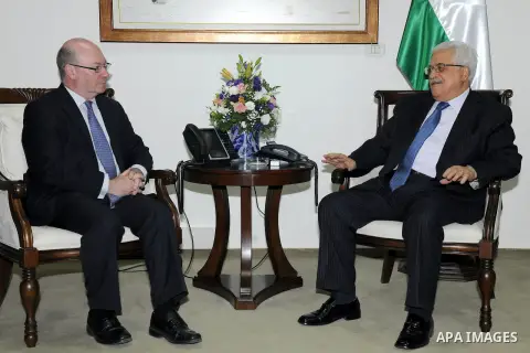 Palestinian President Mahmoud Abbas, right, meets with British Government Minister Alistair Burt, in the West Bank city of Ramallah, Wednesday, June 12, 2013. Photo by Thaer Ganaim