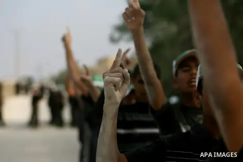 Young Palestinians take part in a summer camp organized by the Islamic movement of Hamas during the youngsters' summer school vacation in Rafah town, in the southern Gaza Strip, on June 12, 2013. The Islamist movement Ha...