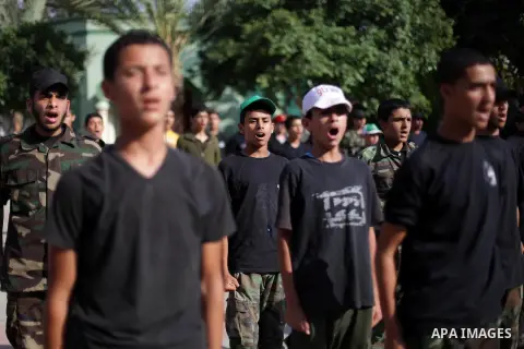 Young Palestinians show their skills during a summer camp graduation ceremony organized by the Islamic movement of Hamas in Deir al-Balah in central of Gaza Strip, June 13, 2013. The Islamist movement Hamas hold summer c...