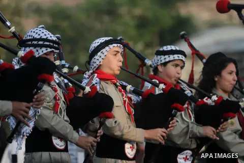 Palestinians take part in the opening of "Apricot Exhibition" in the West Bank village of Jifna northern Ramallah, June 13, 20132. Photo by Issam Rimawi