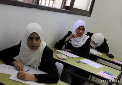 Palestinian students sit for their final high school exams, known as "Tawjihi", in Gaza City on June 15, 2013. Photo by Ashraf Amra