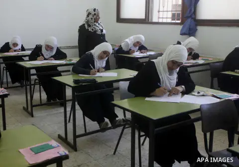 Palestinian students sit for their final high school exams, known as "Tawjihi", in Gaza City on June 15, 2013. Photo by Ashraf Amra