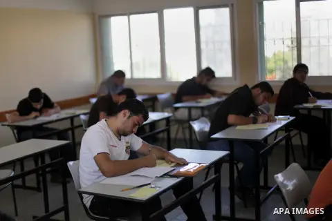 Palestinian students sit for their final high school exams, known as "Tawjihi", in Gaza City on June 15, 2013. Photo by Ashraf Amra