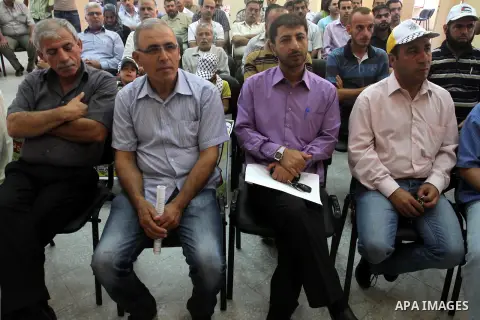 Families of Palestinian prisoners participate in a seminar in solidarity with the martyrs of the revolution Buraq to mark the 83th anniversary of the execution of prisoners of Akka jail by the the British army in Qalaa j...