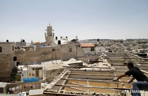 A Palestinian man from Hijazi family destroys his family home in Jerusalem's Old City on June 22, 2013. Monther Hijazi, 65, decided to demolish his own home to carry out an Israeli court order, following pay 40,000 sheke...