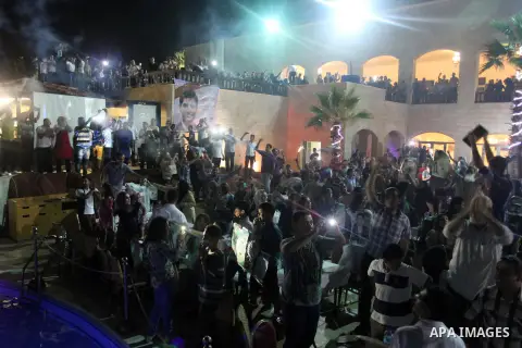 Palestinians celebrate after Palestinian singer Mohammed Assaf won a regional TV singing contest, in front of Assaf's home, Gaza City, June 22, 2013. Palestinians relished a rare moment of pride and national unity Saturd...