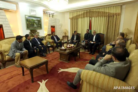 Palestinian Prime Minister in Gaza, Ismail Haniyeh meets with Zulkifli ABDUL RAZAK, President of International Association of Universities, in Gaza city June 25, 2013. Photo by Ahmed Shaat