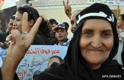 Egyptian opposition protesters take part in a demonstration in front of ministry of Defense against Egyptian president Mohamed Morsi, demanding for his removal, and the army to take control of the country in his stead, i...