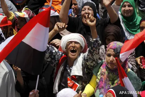 Protesters opposing Egyptian President Mohamed Mursi holds a sign during a protest at Tahrir square in Cairo June 30, 2013. Mass demonstrations across Egypt on Sunday may determine its future, two and half years after pe...