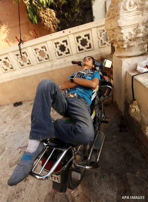 Protesters opposing Egyptian President Mohamed Mursi sleep during a sit-in protest at Tahrir Square in Cairo July 1, 2013. Egypt was locked in a tense standoff on Monday after millions of protesters swarmed into the stre...