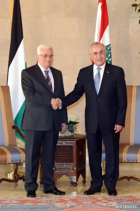 Lebanese President Michel Suleiman (R) shakes hands with Palestinian President Mahmud Abbas (L) at the Presidential palace in Baabda east of Beirut, Lebanon, 03 July 2013. Abbas flew to Lebanon via Jordan, and is expecte...