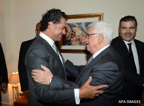Palestinian President Mahmoud Abbas meets with Lebanese singer Ragheb Allama, in Beirut, Lebanon July 04, 2013. Abbas arrived in Beirut on 03 July for a three-day official visit to meet with the Lebanese officials. Photo...