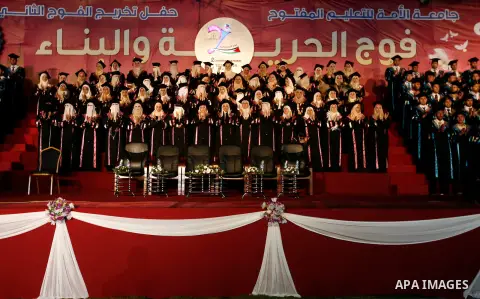 Palestinian students take part in the graduation ceremony at al-Ummah University, in Gaza city on July 04, 2013. Photo by Emad Nassar
