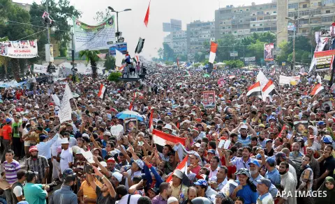 Supporters of deposed Egyptian President Mohamed Mursi shout slogans as they rally at the Raba El-Adwyia square where they are camping in Cairo July 8, 2013. At least 51 people were killed on Monday when demonstrators en...