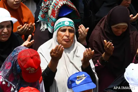 Egyptian supporters of deposed president Mohamed Morsi pray during a rally in support of the former Islamist leader outside Cairo's Rabaa al-Adawiya mosque on July 9, 2013. Egypt's interim leader vowed fresh elections by...