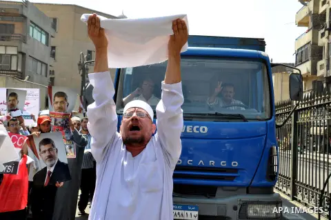 Egyptian clerics, take part in a rally in supporting the ousted Egyptian President Mohammed Morsi, in front of al-Azhar mosque in Cairo, Egypt, Sunday, July 14, 2013. Egypt's military chief has defended the ouster of the...